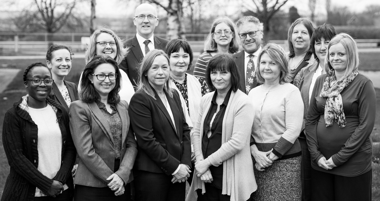 barratts-team-bw Barratts team photograhed outside against trees