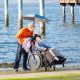Disabled boy in a wheelchair on the beach