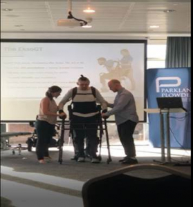 Author of the spinal injury guide - Ed - in an exoskeleton